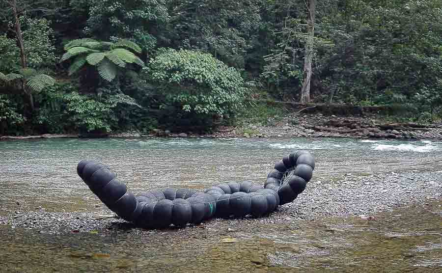 Tube rafting or tubing on the trekking river of Bukit Lawang in Sumatra