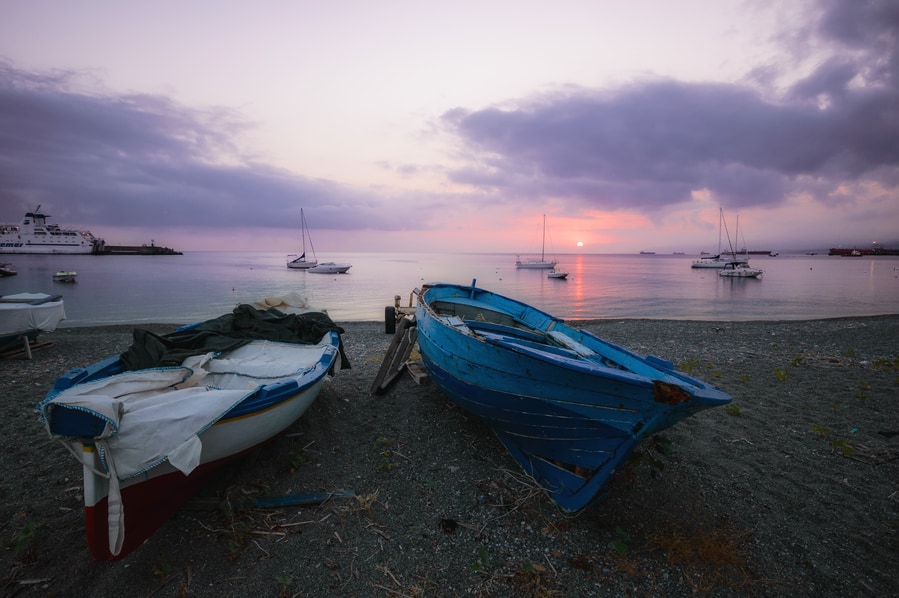 how to get to stromboli from milazzo Boats on the sand of Milazzo at sunrise Sicily Italy
