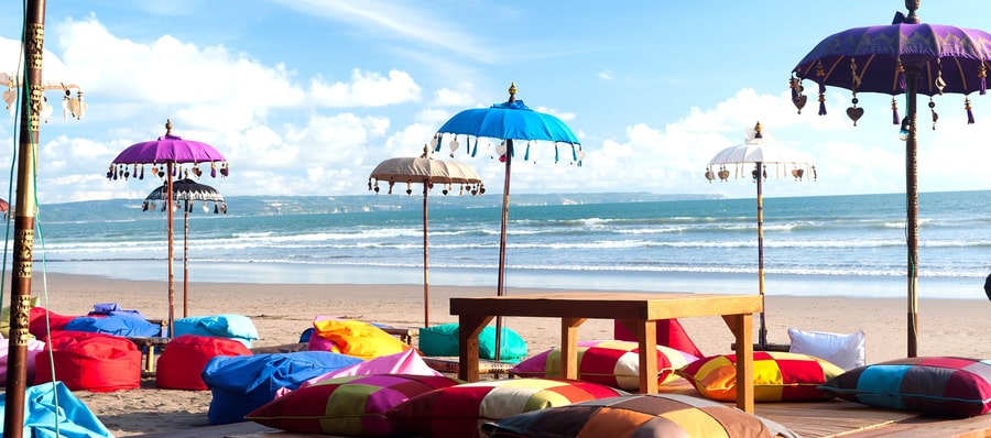 colored umbrellas kuta bali beach colored umbrellas in kuta, one of the best areas to stay in Bali