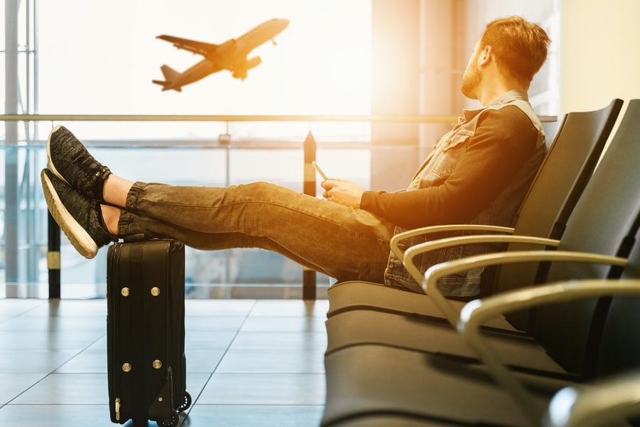 Traveler waiting in airport lounge, airhelp claim status