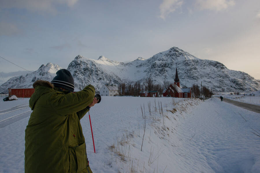 Photography tour participant taking a photo of Flakstad church