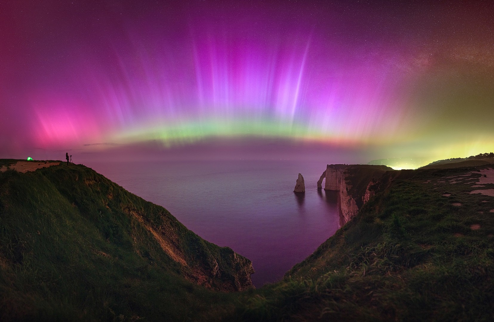 Aurora covering the entire night sky over the coast in France Northern Lights over the coast in France