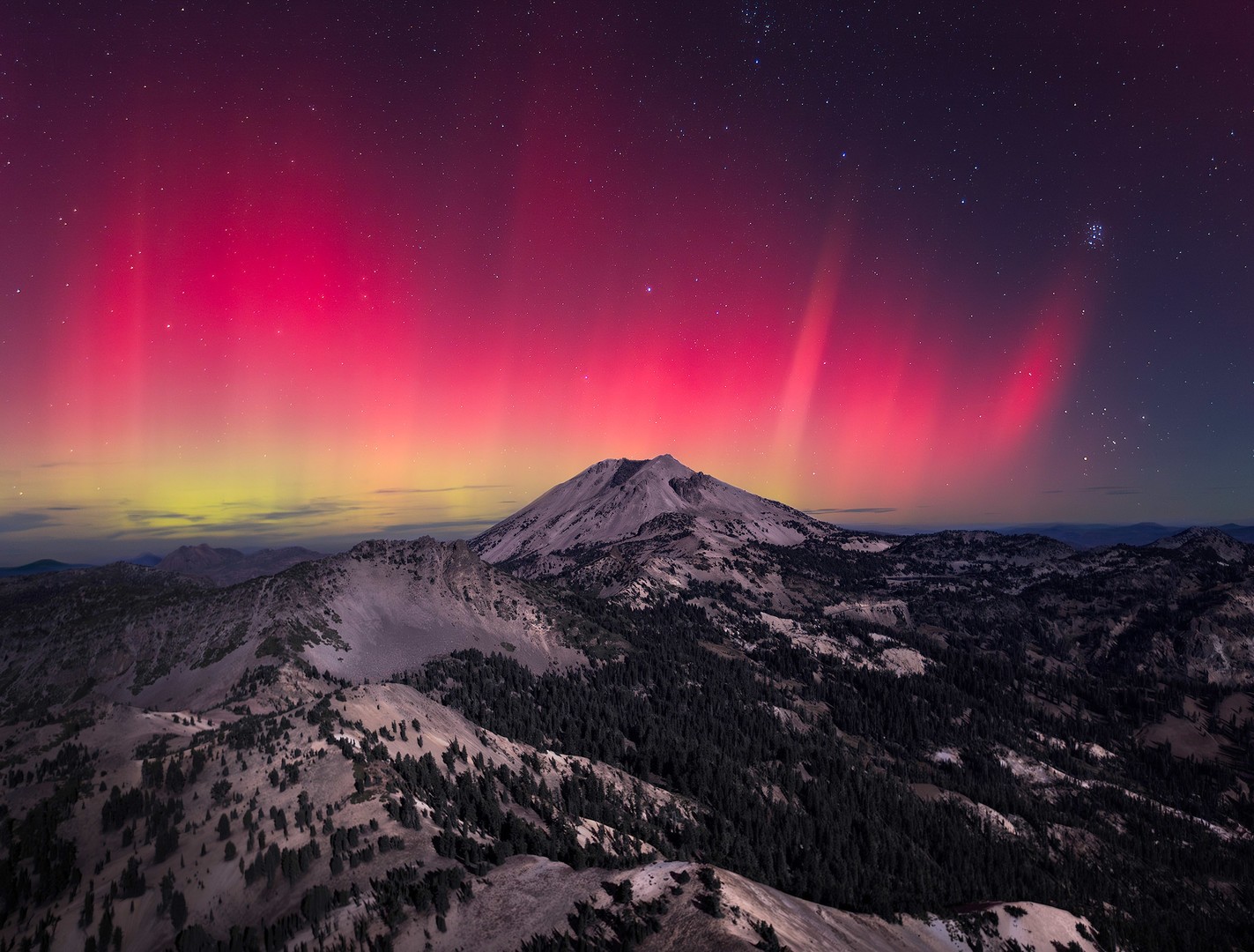 Brigh red Aurora covering the entire night sky Bright red northern lights over mountain