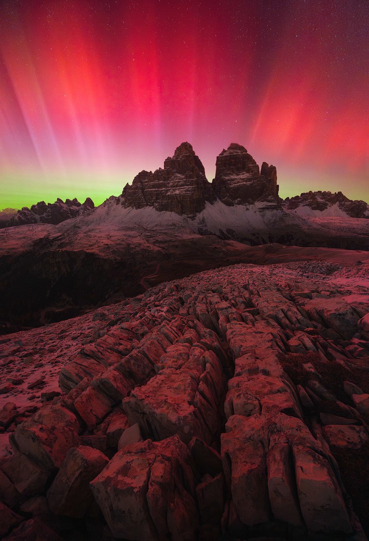Aurora in the Dolomites Bright red aurora over Tre Cime di Lavaredo in the Dolomites