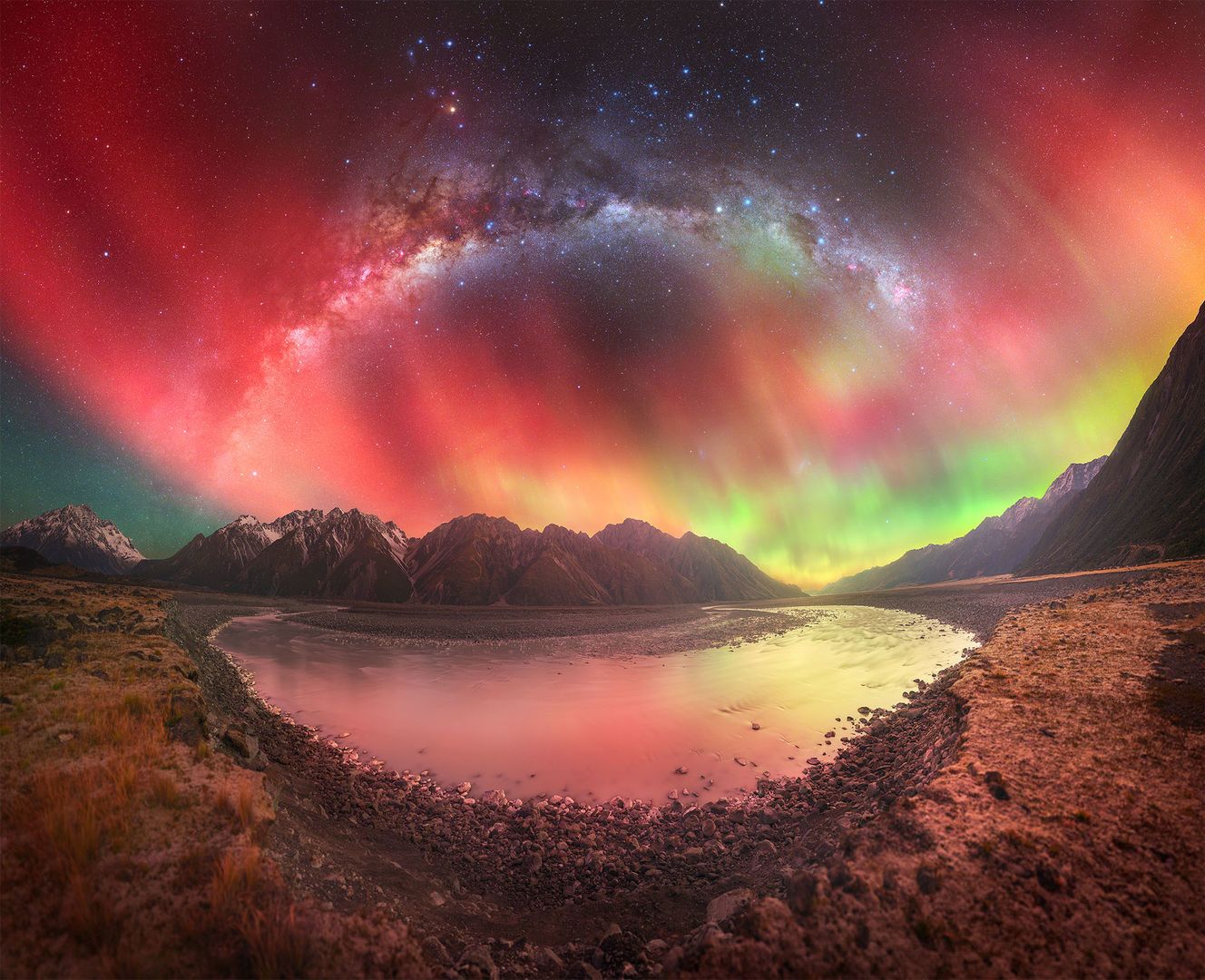 Bright red aurora in New Zealand Aurora australis fills the night sky with a bright red color alongside the Milky Way in New Zealand