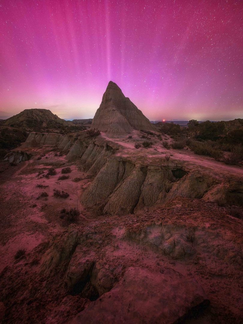 Northern Lights in Monegros, Spain Bright pink northern lights covering the night sky