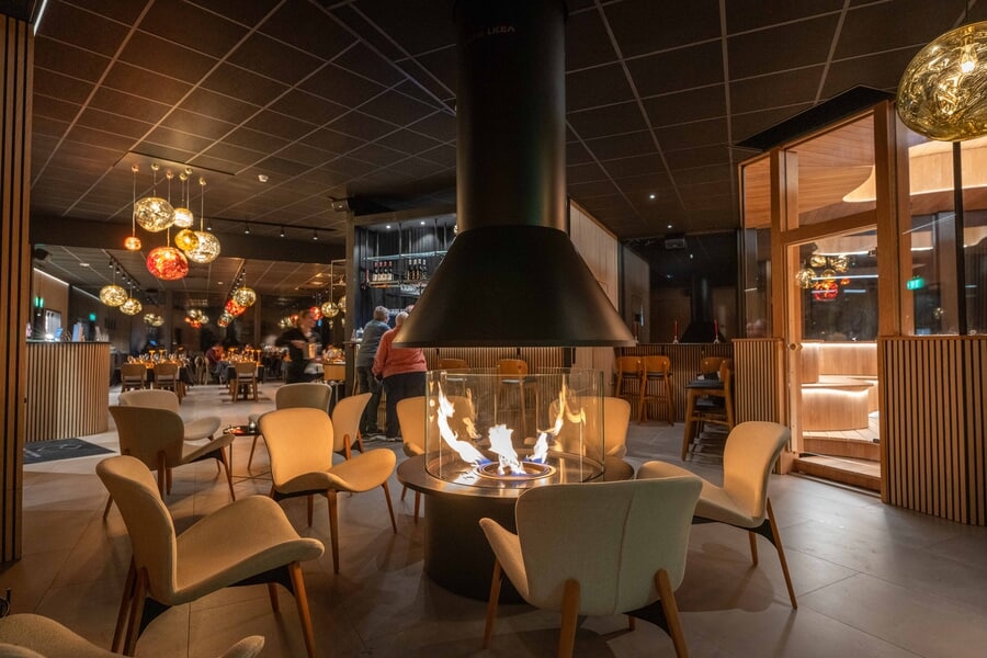 Fireplace lounge at Invisible Forest Lodge Fireplace in Invisible Forest Lodge Rovaniemi